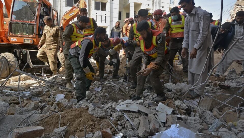 Security officials and rescue workers conduct an operation to clear the rubble and search for bodies at the site of Monday's suicide bombing, in Peshawar, Pakistan, Tuesday, Jan. 31, 2023. The death toll from the previous day's suicide bombing at a mosque in northwestern Pakistani rose to more than 85 on Tuesday, officials said. The assault on a Sunni Mosque inside a major police facility was one of the deadliest attacks on Pakistani security forces in recent years. (AP Photo/Muhammad Zubair)